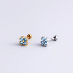 Pair of four-leaf clover stud earrings in gold and silver finish with blue zircon stones