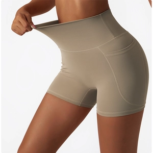 Detail showing the high-elasticity fabric and functional side pocket on sports shorts
