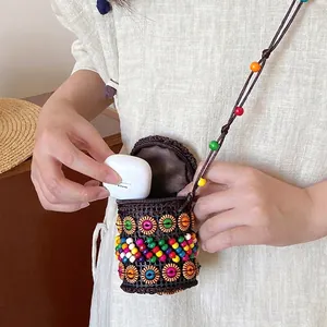 Bohemian handmade woven coconut shell mini crossbody bag with colorful beads for earphones