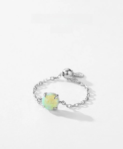 Adjustable S925 sterling silver chain ring featuring a round green opal with soft fire