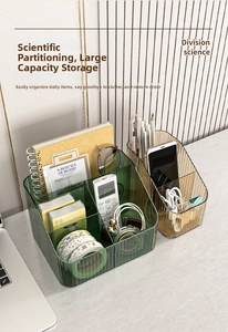 Close-up of divided desktop storage box with vertical stripes and translucent finish