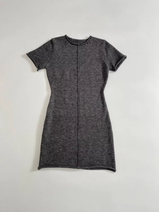 Detail of grey knitted mini dress showing soft fabric texture and vertical seam design