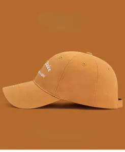 Detail view of khaki cotton baseball cap with white Stake CHASERS side embroidery