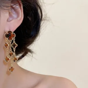 Gold-plated clover tassel drop earrings with amber crystal charms in a retro style