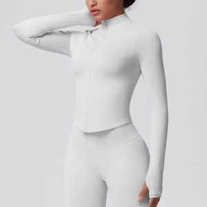 Detail of ribbed white yoga jacket with zipper, thumbholes and standing collar