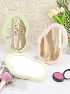 Three irregular cloud-shaped makeup mirrors in pastel green, pink and yellow matte frames