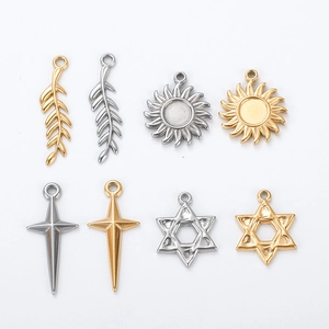 Assorted gold and silver stainless steel pendants with leaf, sun, and star shapes
