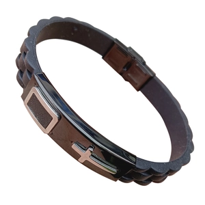 Black silicone sports bracelet with stainless steel cross charm on white background