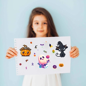Child holding Halloween puzzle stickers featuring pumpkin, witch, and ghost characters