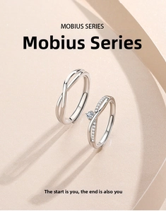 Macro detail of S925 sterling silver Mobius rings with diamond accents and sleek finish