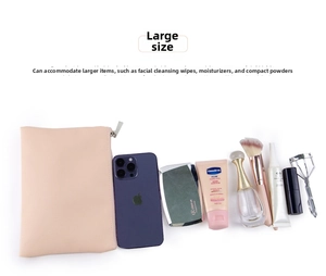 Large pink PU leather pouch showing storage capacity with phone and cosmetics