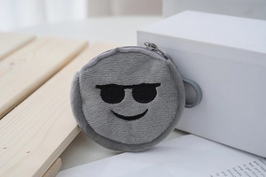 Close-up of a grey plush emoji coin purse with cool sunglasses embroidery and hook