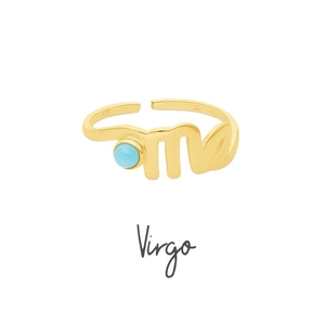 Detailed macro view of gold-plated Virgo zodiac ring with blue zircon birthstone
