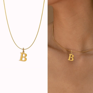 Minimalist gold snake chain necklace featuring a bold capital letter B pendant for women