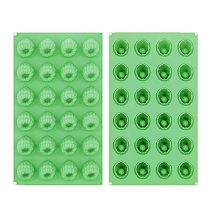 Detailed view of 24-cavity raspberry shaped green silicone mold for DIY baking and crafts