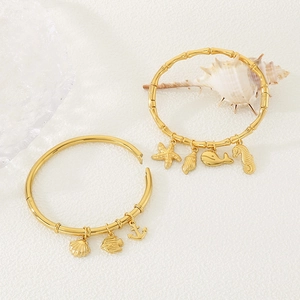 18K gold plated ocean charm bracelet with starfish, seahorse and dolphin pendants