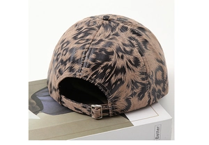 Detail of leopard print baseball cap with adjustable metal buckle on the back side
