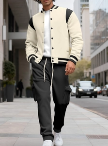 Detail of heavyweight baseball jacket with rib-knit collar and fleece lining in urban setting