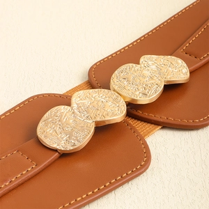 Detail of brown leather wide belt featuring an embossed gold metal interlocking buckle