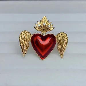 Detailed view of adjustable gold heart wing ring measuring 37.8mm by 34.1mm