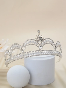 Detail of silver bridal crown featuring round pearls and sparkling crystal rhinestones