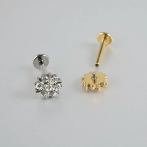 F-136 titanium snowflake labret studs with zircon inlays in gold and silver