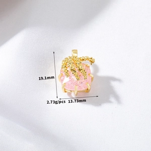 Macro shot of pink heart bow pendant with dimensions 19.1mm x 13.73mm and 2.73g weight