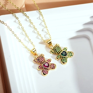 Detail of bear pendants with pink and green micro-pave crystals and heart stones