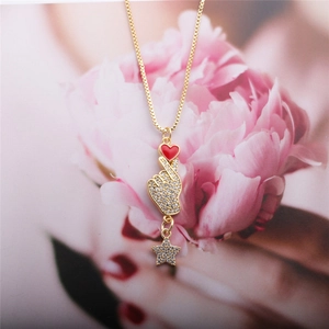 Gold necklace with zircon heart hand gesture and sparkling star pendant decoration