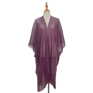 Detailed texture of purple metallic knit shawl featuring shimmering thread and long tassels