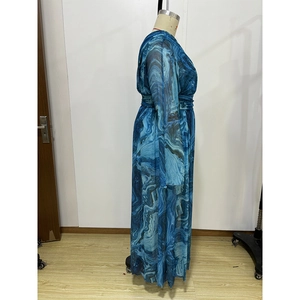 Detail of blue marble print maxi dress featuring long sleeves and a cinched waist design