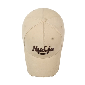 Classic beige cotton baseball cap with vintage embroidery and distressed brim detail