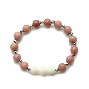 Detail of pink imperial stone, white lava beads and silver spacers on elastic bracelet