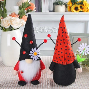 Set of two ladybug-themed Christmas gnomes with sunflowers and plush antennas