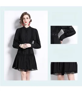 Detail view of lace patchwork lantern sleeves and layered hollow hem on black dress