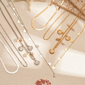 Vierteiliges Gold- und Silber-Halsketten-Set mit Muschel- und Seestern-Anhängern