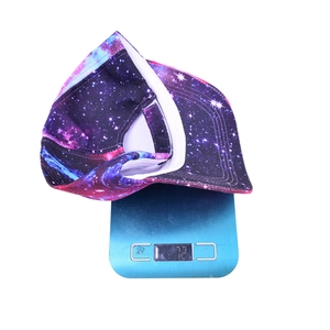 Weight display showing 72g for galaxy tie-dye baseball cap on digital scale