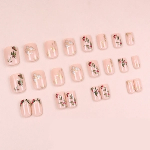Short press-on nails set featuring soft pink base with green leaves and red berry patterns
