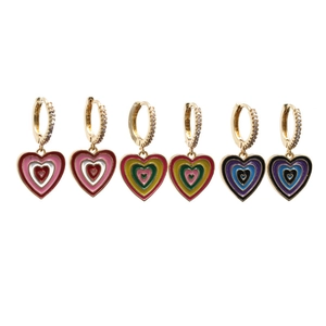 Three pairs of gold heart dangle earrings with colorful enamel and crystal accents