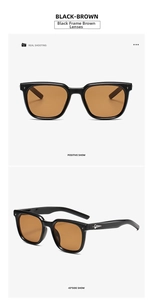 Detail view of black frame sunglasses with brown lenses and metal star studs