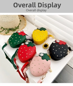 Detailed overhead view of cute strawberry-shaped crossbody bags in five vibrant colors