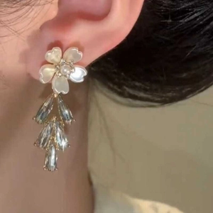 Elegant flower earrings with zircon water drop tassels on female model side view