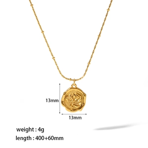 Detail of 13mm rose coin pendant on delicate gold beaded chain necklace with 18K finish