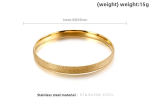Detailed view of gold stainless steel bangle with frosted finish and inner size specifications