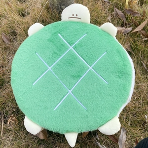 Detail view of turtle memory foam chair cushion showing soft green plush and shell texture