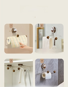 Detail of wall-mounted paper towel holder showing multiple storage scenarios in the home