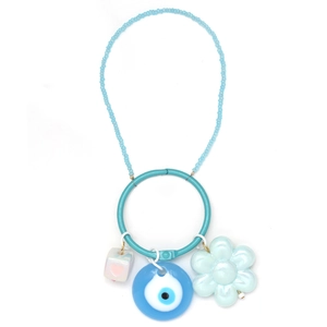 Blue beaded keychain with turquoise ring, evil eye charm and flower pendant on white background