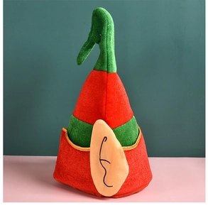 Detail view of red and green Christmas elf hat with pointed ears and felt texture