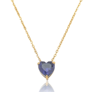 Detail of a heart-shaped blue gemstone pendant with gold chain and micro reflections