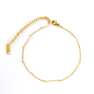 Elegant gold titanium steel anklet featuring side bead accents and adjustable lobster clasp